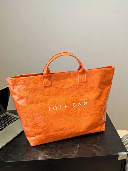 TOTE - Sac spacieux et déperlant