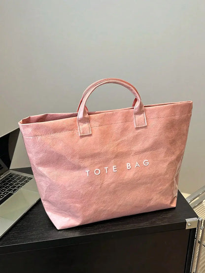 TOTE - Sac spacieux et déperlant